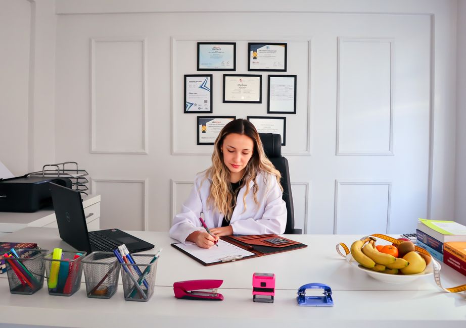 Nutritionist reviewing client materials in an office