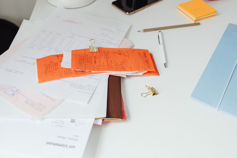 Receipts and documents on top of a desk